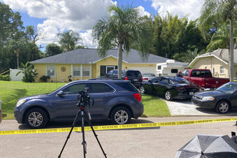 Law enforcement officials swarmed a home in North Port, Fla. on Monday, Sept. 20, 2021, in the disappearance of Gabby Petito, whose body was apparently discovered over the weekend at a Wyoming national park. The officers served a search warrant at the home of the parents of her 23-year-old boyfriend Brian Laundrie, who is wanted for questioning. (AP Photo/Curt Anderson)