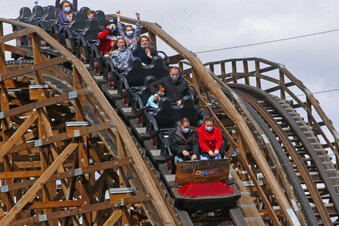 FILE -  In this May 23, 2020, file photo, visitors ride the roller coaster at Lagoon Amusement Park in Farmington, Utah. A paraplegic man, not pictured, who was injured on a roller coaster at the park is now suing, saying his paralyzed leg wasn't properly secured while he was on the ride and his foot was shredded. The Salt Lake Tribune reports Matthew Christensen filed the lawsuit against Lagoon Amusement Park on Thursday, Sept. 2, 2021, in Davis County's 3rd District Court. (AP Photo/Rick Bowmer, File)