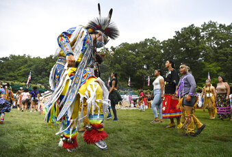 A dancer participates in an intertribal dance at Schemitzun on the Mashantucket Pequot Reservation in Mashantucket, Conn., Saturday, Aug. 28, 2021. Connecticut and a handful of other states have recently decided to mandate students be taught about Native American culture and history.  (AP Photo/Jessica Hill)