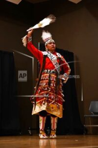 Mahala Sutherland performs a traditional Navajo jingle dress dance at Southern Utah University on Nov. 28, 2021. Sutherland became the first indigenous student to ever be named homecoming royalty at SUU. (McKayla Olsen/Southern Utah University via AP)