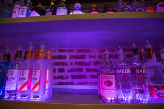 FILE - An empty space on a liquor shelf where Russian vodka used to be located at The Sidetrack, a gay bar on the north side of Chicago, July 29, 2013. The United States and Europe are slapping official sanctions on Russian banks and tech companies.  But bars and liquor stores across America and Canada have found another way to punish Russia for invading Ukraine: They’re pulling Russian vodka off their shelves and promoting Ukrainian brands instead. (AP Photo/Scott Eisen)
