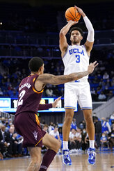 UCLA guard Johnny Juzang (3) shoots over Arizona State forward Jalen Graham (2) during the first half of an NCAA college basketball game Monday, Feb. 21, 2022, in Los Angeles. (AP Photo/Marcio Jose Sanchez)