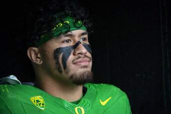 FILE - Oregon linebacker Noah Sewell (1) waits to enter the field before an NCAA college football game in Eugene, Ore., Saturday, Nov. 27, 2021. Sewell was named to the Associated Press preseason All-America team, Monday, Aug. 22, 2022.(AP Photo/Andy Nelson, File)