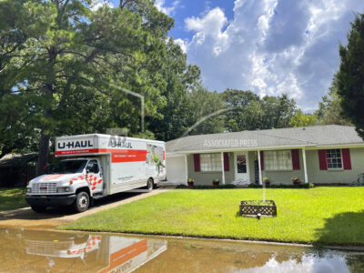 Residents in the North Canton Circle neighborhood of Jackson, Miss., on Monday, Aug. 29, 2022, were advised to evacuate from impending floodwaters. Some moved out all of their possessions in U-Haul trucks or cars. (AP Photo/Michael Goldberg)