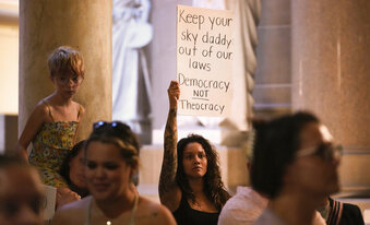 FILE - Demonstrators stand outside the House chamber before a vote is held on Senate Bill 1 during a special session Friday, Aug. 5, 2022, at the Indiana Statehouse in Indianapolis. Critics of religious freedom laws often argue they are used to discriminate against LGBTQ people and only protect a conservative Christian worldview. But following the U.S. Supreme Court’s overturning of Roe v. Wade in June, religious abortion-rights supporters are using these laws to protect access to abortion and defend their beliefs. (Jenna Watson/The Indianapolis Star via AP, File)