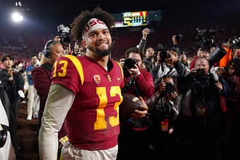 FILE - Southern California quarterback Caleb Williams smiles after USC defeated Notre Dame 38-27 in an NCAA college football game Saturday, Nov. 26, 2022, in Los Angeles. Southern California quarterback Caleb Williams was named the AP Player of the Year in college football, Thursday, Dec. 8, 2022. (AP Photo/Mark J. Terrill, File)