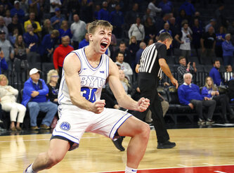 BYU guard Dallin Hall (30) reacts to his team's win at the end of an NCAA college basketball game against Creighton Saturday, Dec. 10, 2022, in Las Vegas. BYU won 83 to 80. (AP Photo/Ronda Churchill)