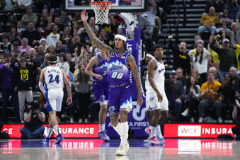 Utah Jazz guard Jordan Clarkson (00) celebrates after a teammate scored against the Washington Wizards during the second half of an NBA basketball game Thursday, Dec. 22, 2022, in Salt Lake City. (AP Photo/Rick Bowmer)