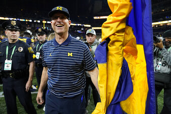 Michigan head coach Jim Harbaugh smiles after defeating Purdue in the Big Ten championship NCAA college football game, early Sunday, Dec. 4, 2022, in Indianapolis. Michigan won, 43-22. (AP Photo/Michael Conroy)