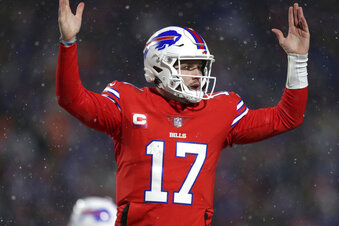 Buffalo Bills quarterback Josh Allen (17) celebrates after diving for a two-point conversion during the second half of an NFL football game against the Miami Dolphins in Orchard Park, N.Y., Saturday, Dec. 17, 2022. (AP Photo/Joshua Bessex)