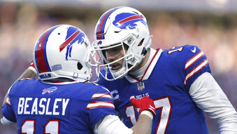 Buffalo Bills wide receiver Cole Beasley (11), left, is congratulated by quarterback Josh Allen after his touchdown catch during the second half of an NFL wild-card playoff football game against the Miami Dolphins, Sunday, Jan. 15, 2023, in Orchard Park, N.Y. (AP Photo/Joshua Bessex)