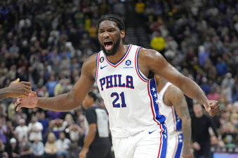 Philadelphia 76ers center Joel Embiid (21) celebrates following a victory over the Utah Jazz in an NBA basketball game Saturday, Jan. 14, 2023, in Salt Lake City. (AP Photo/Rick Bowmer)