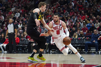 Utah Jazz forward Lauri Markkanen (23) defends Chicago Bulls guard Zach LaVine (8) during the first quarter of a NBA basketball game Saturday, Jan. 7, 2023, in Chicago. (AP Photo/David Banks)