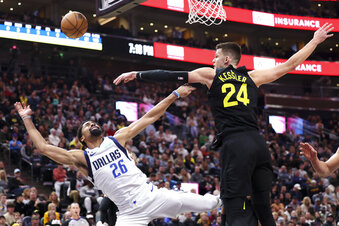 Dallas Mavericks guard Spencer Dinwiddie (26) has a shot blocked by Utah Jazz center Walker Kessler (24) in the first quarter of an NBA basketball game Saturday, Jan. 28, 2023, in Salt Lake City. (AP Photo/Rob Gray)