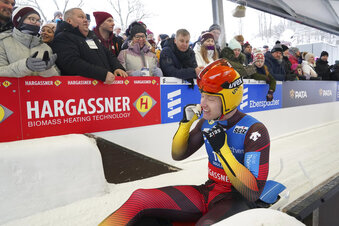Max Langenhan of Germany smiles after he placed second after his second run of the Luge World Cup race in Sigulda, Latvia, Sunday, Jan. 8, 2023. (AP Photo/Roman Koksarov)