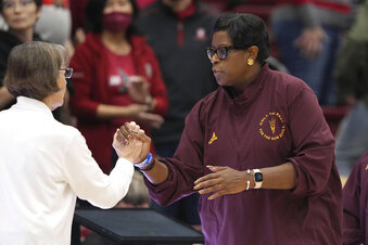 Arizona State coach Natasha Adair, right, shakes hands with Stanford coach Tara VanDerveer after an NCAA college basketball game Saturday, Dec. 31, 2022, in Stanford, Calif. Stanford won 101-69. (AP Photo/Darren Yamashita)
