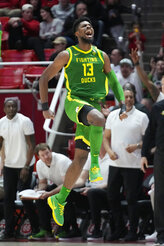 Oregon forward Quincy Guerrier (13) celebrates after scoring a 3-point basket against Utah during the second half of an NCAA college basketball game Saturday, Jan. 7, 2023, in Salt Lake City. (AP Photo/Rick Bowmer)