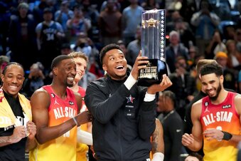 Giannis Antetokounmpo hold up the winning team trophy after the NBA basketball All-Star game Sunday, Feb. 19, 2023, in Salt Lake City. (AP Photo/Rick Bowmer)