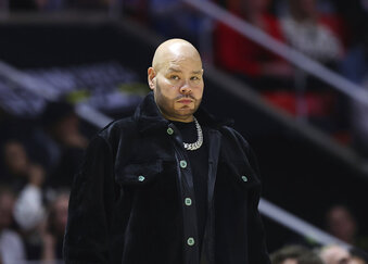 Entertainer Fat Boy watches during the first half of an NBA All-Star Celebrity Game, Friday, Feb. 17, 2023, in Salt Lake City. (AP Photo/Rob Gray)