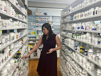 Gwendolyn Herzig speaks to a reporter at Park West Pharmacy in Little Rock, Arkansas on Wednesday, Feb. 22, 2023. Herzig, who is transgender, was asked about her genitalia by an Arkansas lawmaker when she testified about a bill restricting gender affirming care for minors. The question is an example of the rhetoric transgender people are facing at statehouses as they speak out against new bills targeting their rights. (AP Photo/Andrew DeMillo)