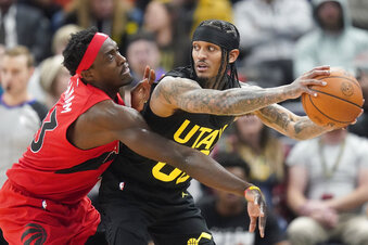 Toronto Raptors forward Pascal Siakam, left, guards Utah Jazz guard Jordan Clarkson, right, during the first half of an NBA basketball game Wednesday, Feb. 1, 2023, in Salt Lake City. (AP Photo/Rick Bowmer)