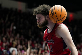 Saint Mary's guard Logan Johnson reacts after scoring against BYU during the first half of an NCAA college basketball game in Moraga, Calif., Saturday, Feb. 18, 2023. (AP Photo/Godofredo A. Vásquez)