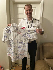 In this undated photo provided by Michael Walton, his brother Scott Walton poses in his pilot uniform. Scott Walton, 46, was among five killed when the medical flight he was piloting crashed in rural northern Nevada on Friday, Feb. 24, 2023. There were no survivors. (Courtesy of Michael Walton via AP)