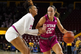Utah's Jenna Johnson (22) works her way around Arizona State's Treasure Hunt, left, during an NCAA college basketball game, Sunday, Feb. 19, 2023, in Tempe, Ariz. (AP Photo/Darryl Webb)