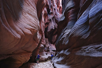 Sunlight peeks into the narrows of Buckskin Gulch in Kane County, Utah, on Sunday, Sept. 25, 2016.  One man is dead and another is still missing after floodwaters poured into a slot canyon in southern Utah, endangering three groups of hikers who had to be hoisted out via helicopter Tuesday, March 14, 2023. The hikers were on a multi-day trek from Wire Pass to Lees Ferry through Buckskin Gulch's sandstone features that includes multiple narrow slot canyons.  (Lennie Mahler /The Salt Lake Tribune via AP)