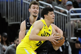 Utah Jazz's Simone Fontecchio, right, makes a move to get around Orlando Magic's Franz Wagner, left, during the first half of an NBA basketball game, Thursday, March 9, 2023, in Orlando, Fla. (AP Photo/John Raoux)