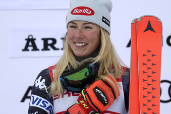FILE - United States' Mikaela Shiffrin celebrates on the podium after winning an alpine ski, women's World Cup giant slalom race, in Are, Sweden, Friday, March 10, 2023. Fresh off breaking the record for most World Cup race wins, Mikaela Shiffrin has a new head coach, Karin Harjo, who has been leading Canada’s Alpine skiing team. U.S. Ski & Snowboard announced Harjo’s hiring on Monday, March 13, 2023, and said she will join Shiffrin in April. (AP Photo/Alessandro Trovati, File)