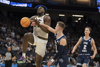 Missouri guard Kobe Brown (24) is fouled by Utah State guard Steven Ashworth (3) during the second half of a first-round college basketball game in the NCAA Tournament in Sacramento, Calif., Thursday, March 16, 2023. (AP Photo/José Luis Villegas)