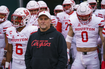 FILE - Houston head coach Dana Holgorsen waits to lead his team onto the field before an NCAA college football against Temple, Saturday, Nov. 13, 2021, in Philadelphia. Before Holgerson got to Houston, one of four schools that will officially become new Big 12 members on July 1, 2023, he was West Virginia's coach when the Mountaineers were part of the conference's last composition change in 2012. (AP Photo/Chris Szagola, File)