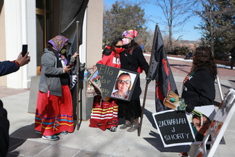 FILE - Seraphine Warren, center left, is embraced by state Sen. Shannon Pinto outside the state capitol building on Friday, Feb. 4, 2022, in Santa Fe, N.M. They participated in a rally drawing attention to murdered and missing Ingenious peoples, including Warren's aunt Ella Mae Begay, a Navajo woman who went missing in June of 2021. A federal grand jury has indicted a New Mexico man on assault and carjacking charges in connection with the 2021 disappearance of Ella Mae Begay in a case that has helped raise awareness about missing and unsolved slayings in Indian Country. (AP Photo/Cedar Attanasio, File)