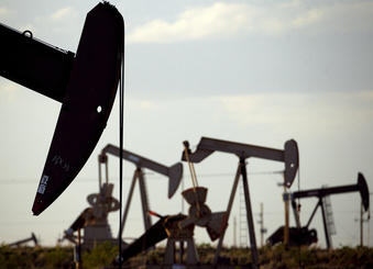 FILE - Pumpjacks work in a field near Lovington, N.M., on  April 24, 2015. Land managers in one of the top oil and gas producing states in the U.S. have plugged more than 200 inactive wells on state trust lands. New Mexico officials announced Wednesday, April 19, 2023, that the cleanup costs are being shouldered by the industry as part of the State Land Office's accountability and enforcement program. (AP Photo/Charlie Riedel, File)