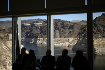 Officials listen during a news conference on Lake Mead at the Hoover Dam Tuesday, April 11, 2023, near Boulder City, Nev. The Biden administration on Tuesday released an environmental analysis of competing plans for how Western states and tribes reliant on the dwindling Colorado River should cut their use. (AP Photo/John Locher)