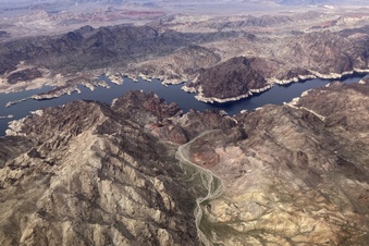 FILE - A bathtub ring shows where the water mark on Lake Mead once was along the boarder of Nevada and Arizona, March 6, 2023, near Boulder City, Nev. Nearly half of the U.S. West has emerged from drought, but intense water challenges persist, scientists said Tuesday, May 9. (AP Photo/John Locher, File)