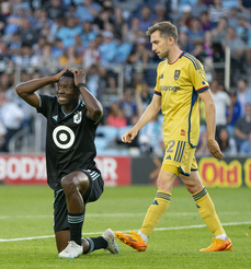 Minnesota United forward Bongokuhle Hlongwane, left, reacts in front of Real Salt Lake defender Andrew Brody (2) after his team narrowly missed a shot-attempt in the first half of an MLS soccer match Saturday, May 27, 2023, in St. Paul, Minn. (Alex Kormann/Star Tribune via AP)