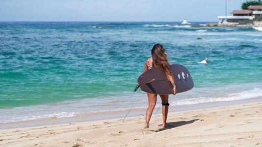 New wave of Hawaiian surfers look to reclaim sport’s cultural spirit