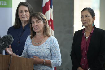 FILE - Tanya Trujillo, assistant secretary for water and science at the Department of the Interior, front, makes a point as U.S. Rep Diana DeGette, D-Colo., back left, and Interior Secretary Deb Haaland look on during a news conference at the offices of Denver Water, July 22, 2021, in Denver. Trujillo, a key official overseeing Colorado River negotiations, will step down from her role with the Interior Department on Monday, July 17, 2023. (AP Photo/David Zalubowski,File)