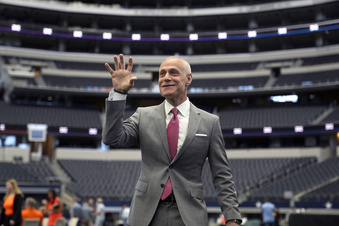Big 12 Commissioner Brett Yormark indulges a student media outlet with a Baylor Bear hand sign before speaking at the opening of the NCAA college football Big 12 media days in Arlington, Texas, Wednesday, July 12, 2023. (AP Photo/LM Otero)