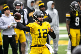 FILE - Iowa quarterback Cade McNamara (12) throws the ball during a spring NCAA college football game, Saturday, April 22, 2023, at Kinnick Stadium in Iowa City, Iowa. McNamara transferred from Michigan and will attempt to revive an offense that ranked among the nation’s worst in 2022. (Joseph Cress/Iowa City Press-Citizen via AP, File)
