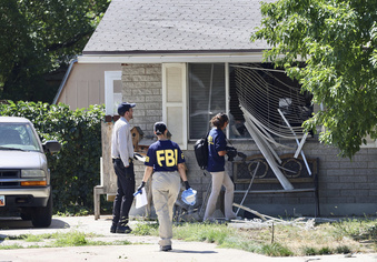 FILE - Law enforcement investigate the scene of a shooting involving the FBI on Aug. 9, 2023, in Provo, Utah. The Utah man accused of making violent threats against President Joe Biden before a western states trip last week pointed a handgun at FBI agents attempting to arrest him, the agency said on Monday, Aug. 14, 2023. (Laura Seitz/The Deseret News via AP, File)