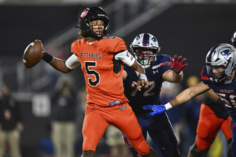 FILE - Pittsburg quarterback Jaden Rashada (5) is pressured by Liberty's Grant Buckey (72) during the second quarter of the 2022 CIF State Football Championship Division 1-A game at Saddleback College in Mission Viejo, Calif., on Dec. 10, 2022. Rashada, who previously decommitted from Miami and Florida, had a long road to starting in Arizona State's opener on Aug. 31, 2023. (Jose Carlos Fajardo/Bay Area News Group via AP, File)