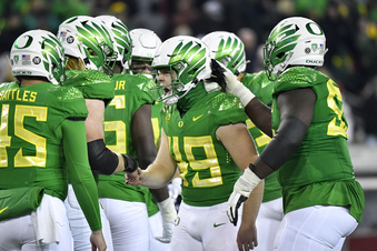 FILE -Oregon place kicker Camden Lewis (49) celebrates with teammates after kicking a field goal against Utah during the second half of an NCAA college football game Saturday, Nov. 19, 2022, in Eugene, Ore. The Big Ten has cleared the way for Oregon and Washington to apply for membership, four people familiar with the negotiations told The Associated Press., Friday, Aug. 4, 2023 (AP Photo/Andy Nelson, File)