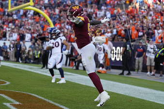 Washington Commanders linebacker Jamin Davis (52) celebrates after a failed two-point conversion-attempt by the Denver Broncos after time ran out in the fourth quarter of an NFL football game Sunday, Sept. 17, 2023, in Denver. (AP Photo/Jack Dempsey)