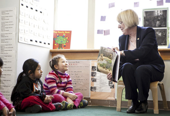 FILE - Senator Patty Murray, D-Wash., reads her favorite children's book, "King Bidgood's in the Bathtub," to preschoolers, including Diego Bicente, 4, left, and Anh Tang, 4, at the Denise Louie Education Center in the International District neighborhood of Seattle, March 25, 2013. Democrats in Congress are pushing for a new round of money to keep the nation’s child care industry afloat, saying thousands of programs are at risk of closing when federal pandemic relief runs out this month.  (Bettina Hansen/The Seattle Times via AP, File)