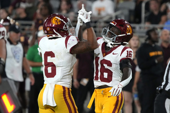 Southern California wide receiver Tahj Washington (16) celebrates with running back Austin Jones after scoring a touchdown against Arizona State in the second half during an NCAA college football game, Saturday, Sept. 23, 2023, in Tempe, Ariz. Southern California won 42-28. (AP Photo/Rick Scuteri)