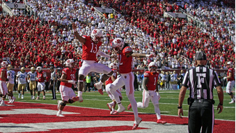 Utah's Landon King (82) celebrates his touchdown with quarterback Nate Johnson (13) during the first half of an NCAA college football game against UCLA, Saturday, Sept. 23, 2023, in Salt Lake City. (AP Photo/Rick Bowmer)