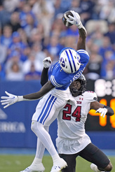 BYU wide receiver Darius Lassiter (5) pulls down a pass as Texas Tech defensive back Malik Dunlap (24) looks on during the first half of an NCAA college football game Saturday, Oct. 21, 2023, in Provo, Utah. (AP Photo/Rick Bowmer)